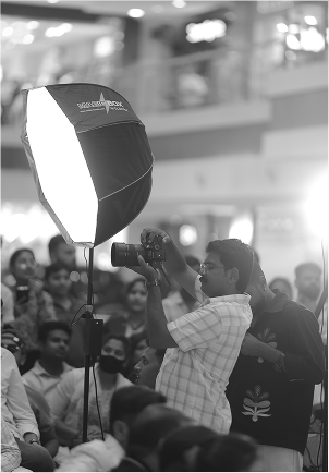 Event photography lighting setup with crowd